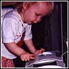 Thumbnail of Bethany watching the bread bake in the bread machine...